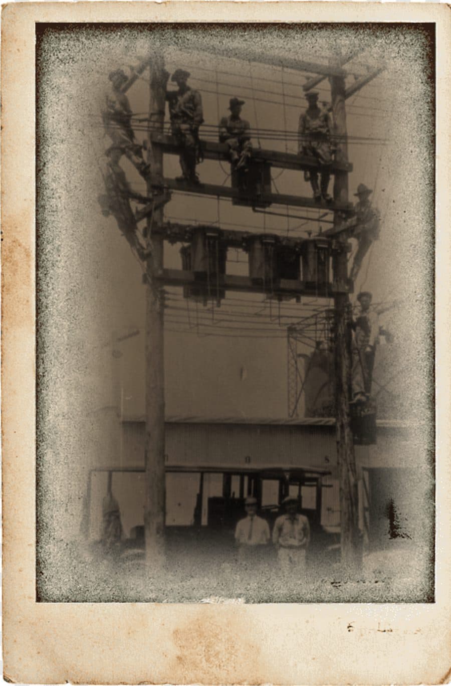 Historic line crew on a transmission structure