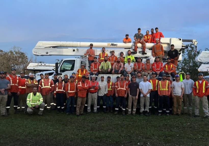 Line crew gathered on a job site