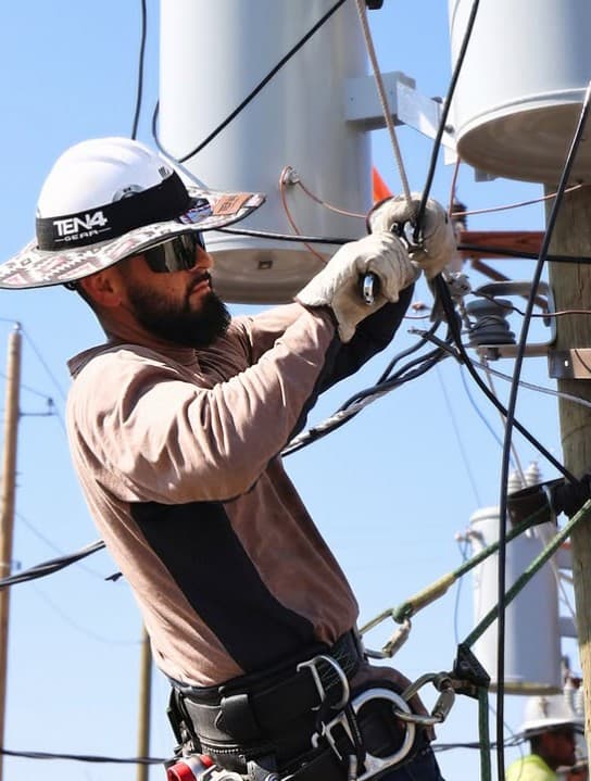 Lineworker in a hard hat on a hot day
