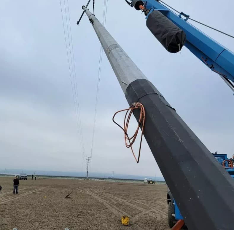 Transmission pole installation in progress