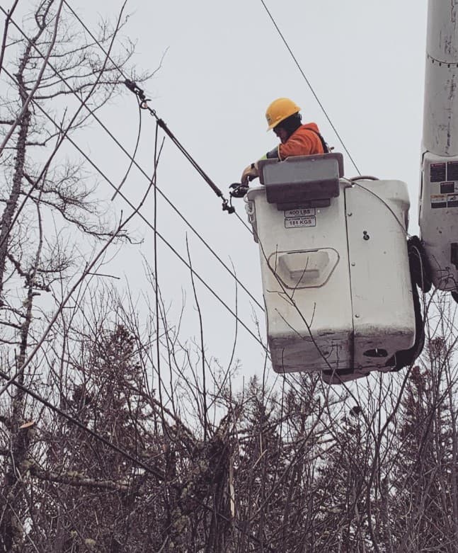 Lineworker mid-task on an energized line